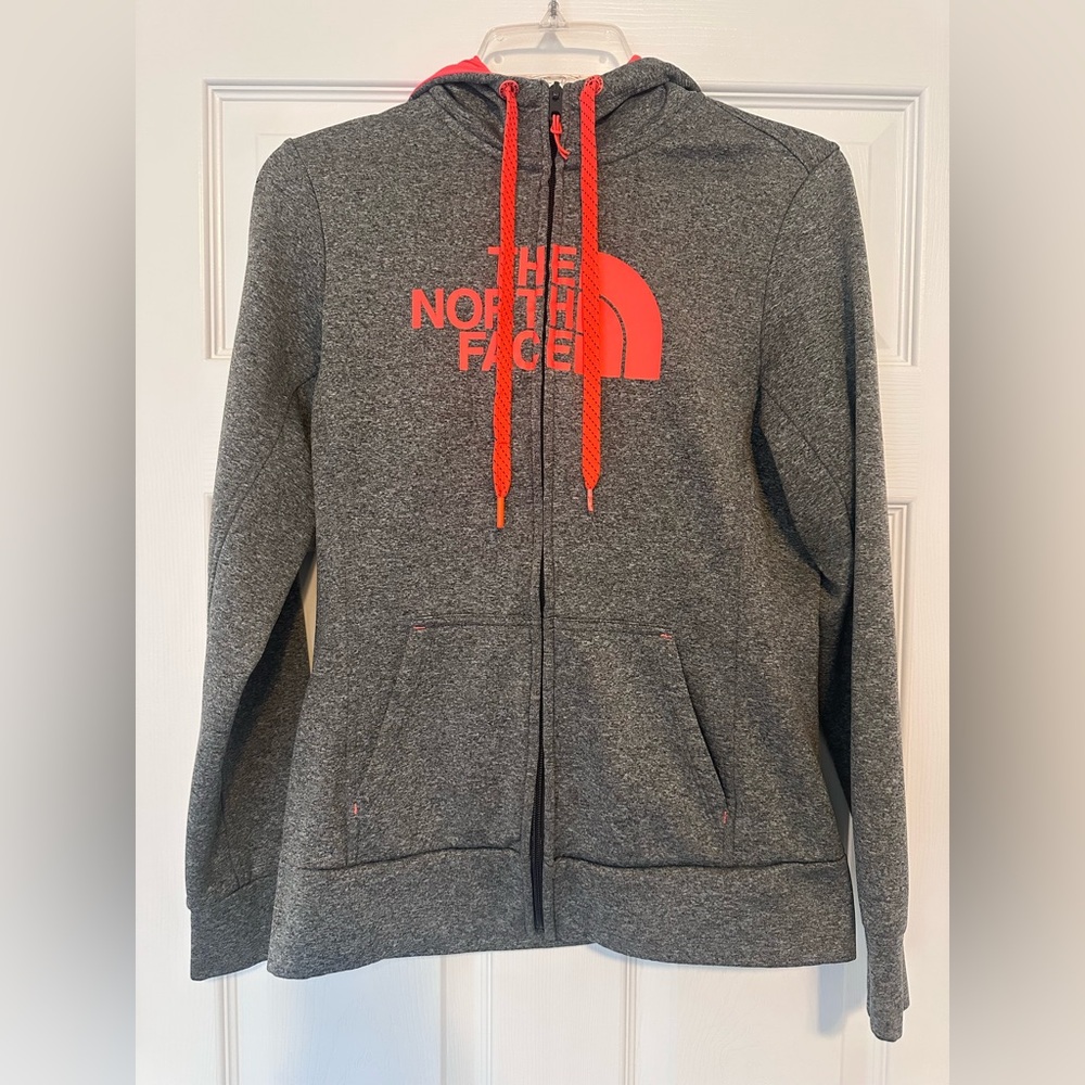 The North Face womens  charcoal zip-up hoodie with Orange Highlights